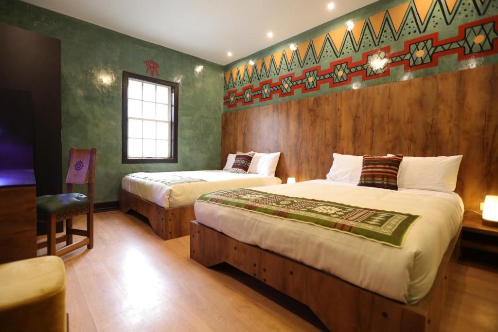 Postel nebo postele na pokoji v ubytování Chakana Hotel Boutique Mariscal