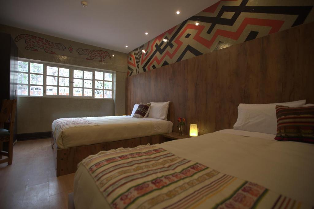 Postel nebo postele na pokoji v ubytování Chakana Hotel Boutique Mariscal