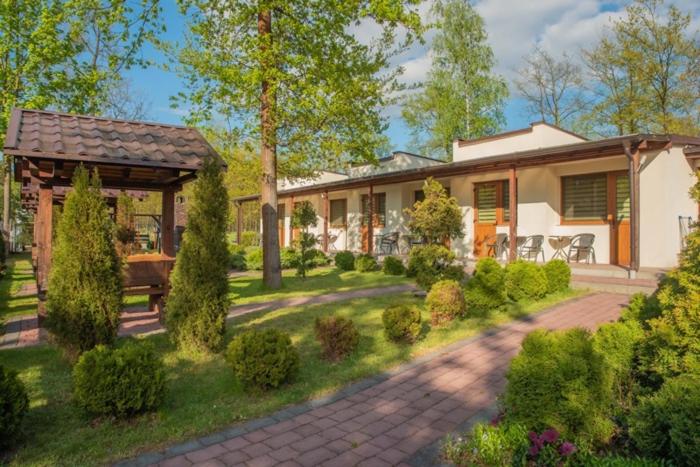 a house with a pavilion in a yard at Ostoja in Turawa