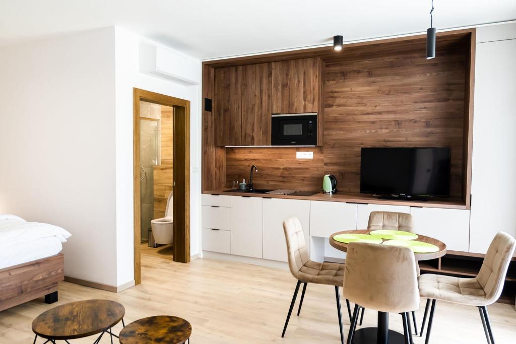 TV a/nebo společenská místnost v ubytování Apartmány Hájenka Oravice