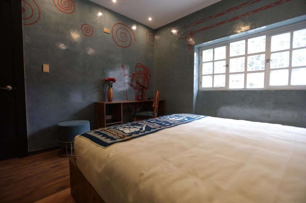 Postel nebo postele na pokoji v ubytování Chakana Hotel Boutique Mariscal
