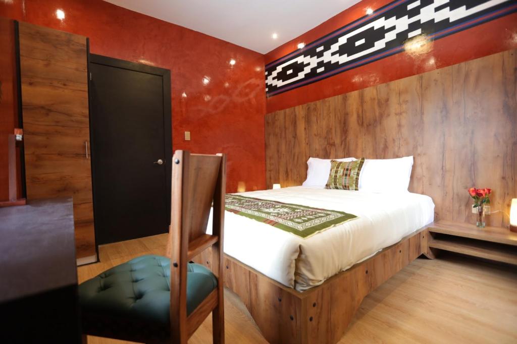 Postel nebo postele na pokoji v ubytování Chakana Hotel Boutique Mariscal