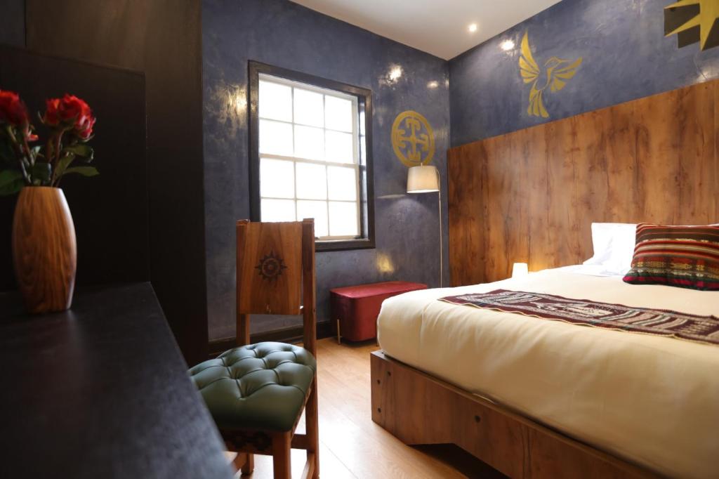Postel nebo postele na pokoji v ubytování Chakana Hotel Boutique Mariscal