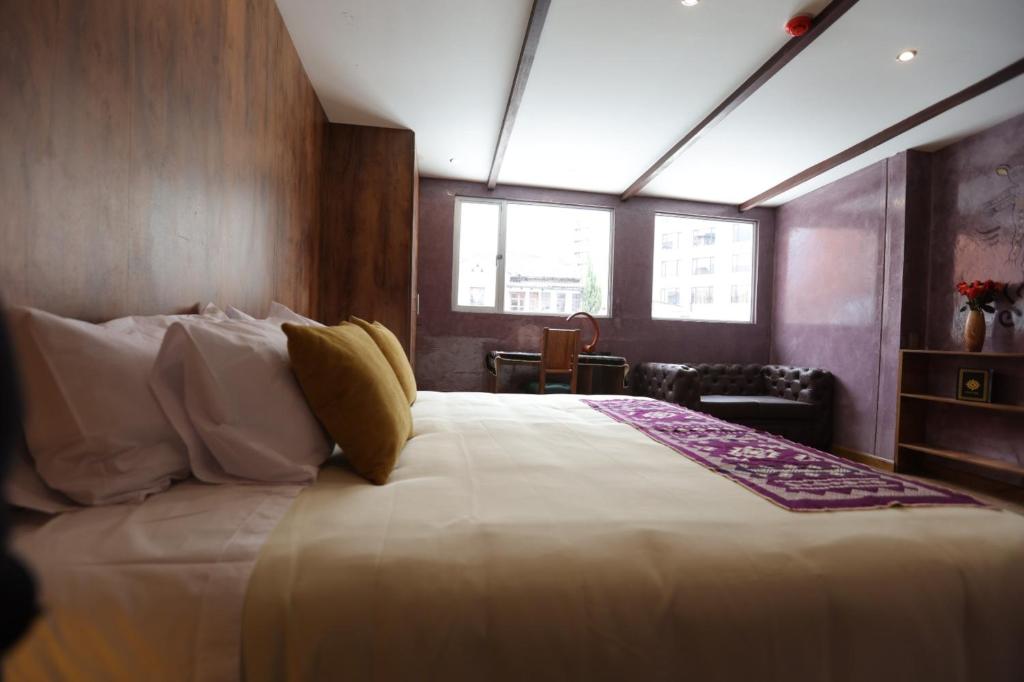 Postel nebo postele na pokoji v ubytování Chakana Hotel Boutique Mariscal