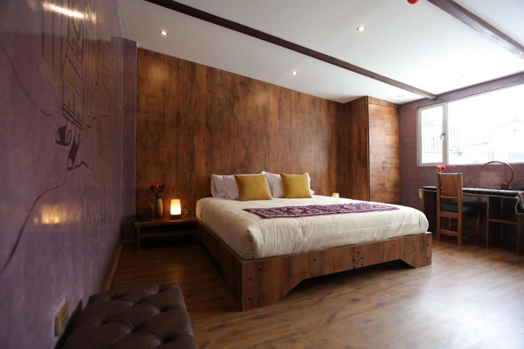 Postel nebo postele na pokoji v ubytování Chakana Hotel Boutique Mariscal