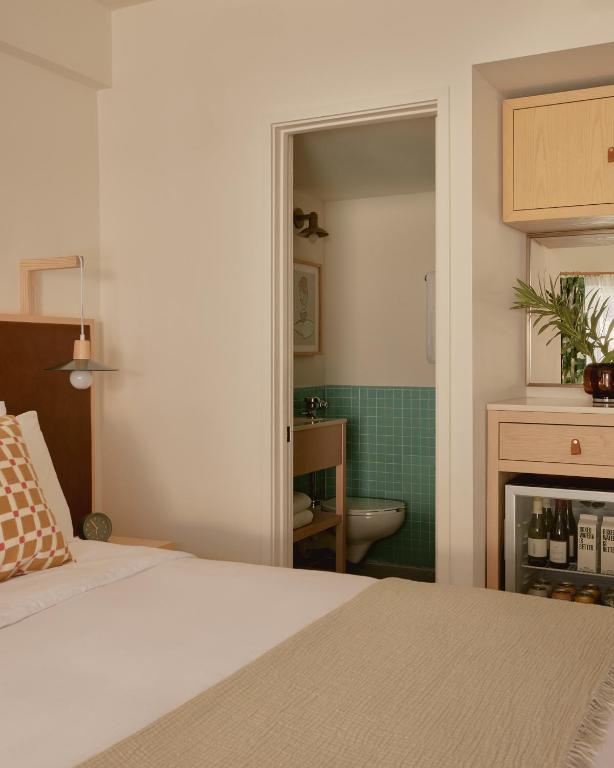 Postel nebo postele na pokoji v ubytování Hotel Lucine
