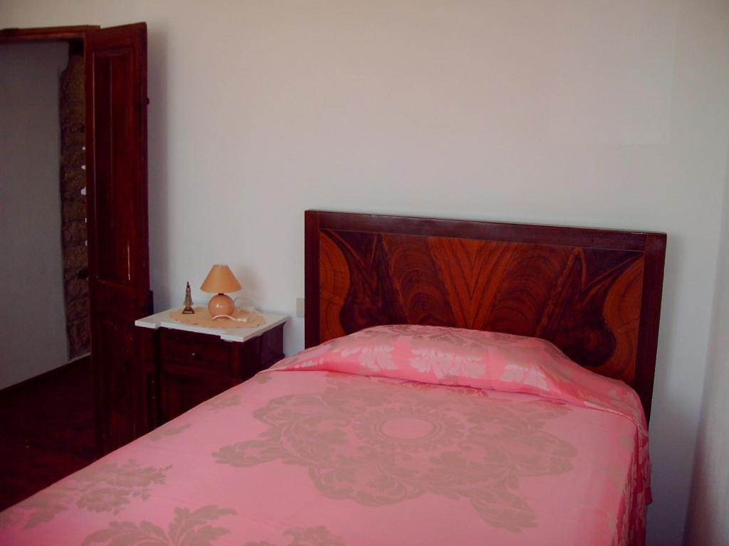En eller flere senge i et værelse på B&B Nonna Peppina