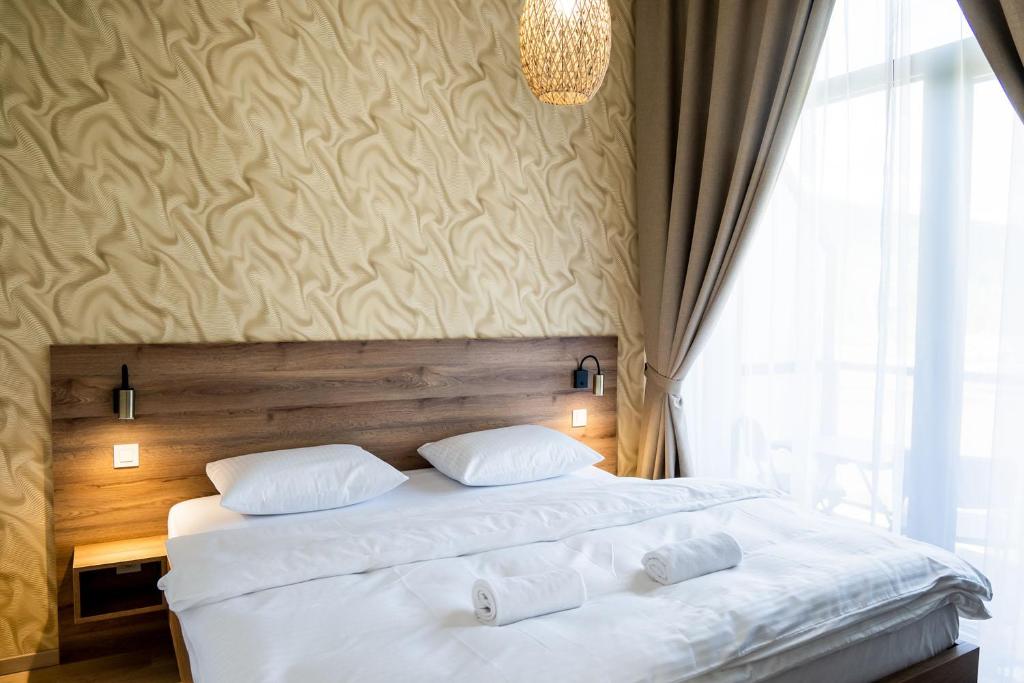 Postel nebo postele na pokoji v ubytování Apartmány Hájenka Oravice
