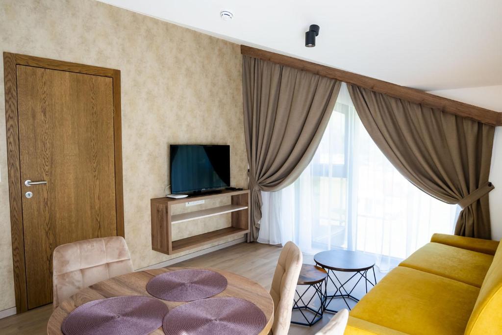 TV a/nebo společenská místnost v ubytování Apartmány Hájenka Oravice