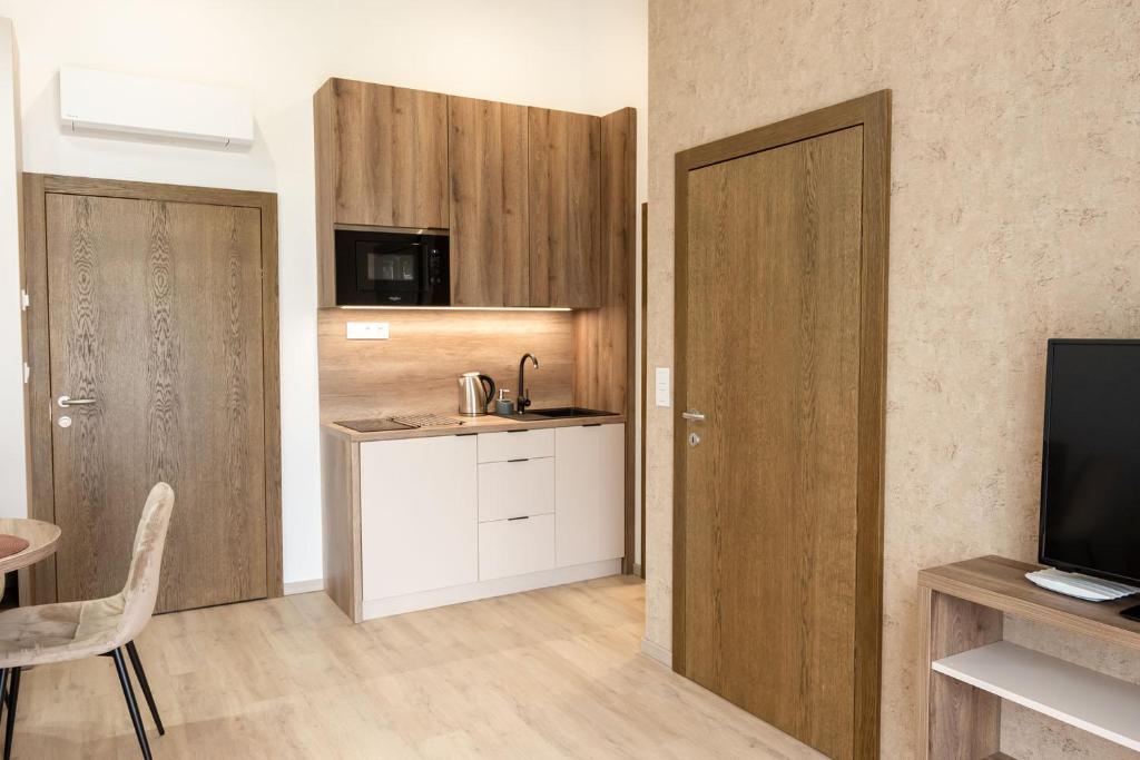 Kuchyň nebo kuchyňský kout v ubytování Apartmány Hájenka Oravice