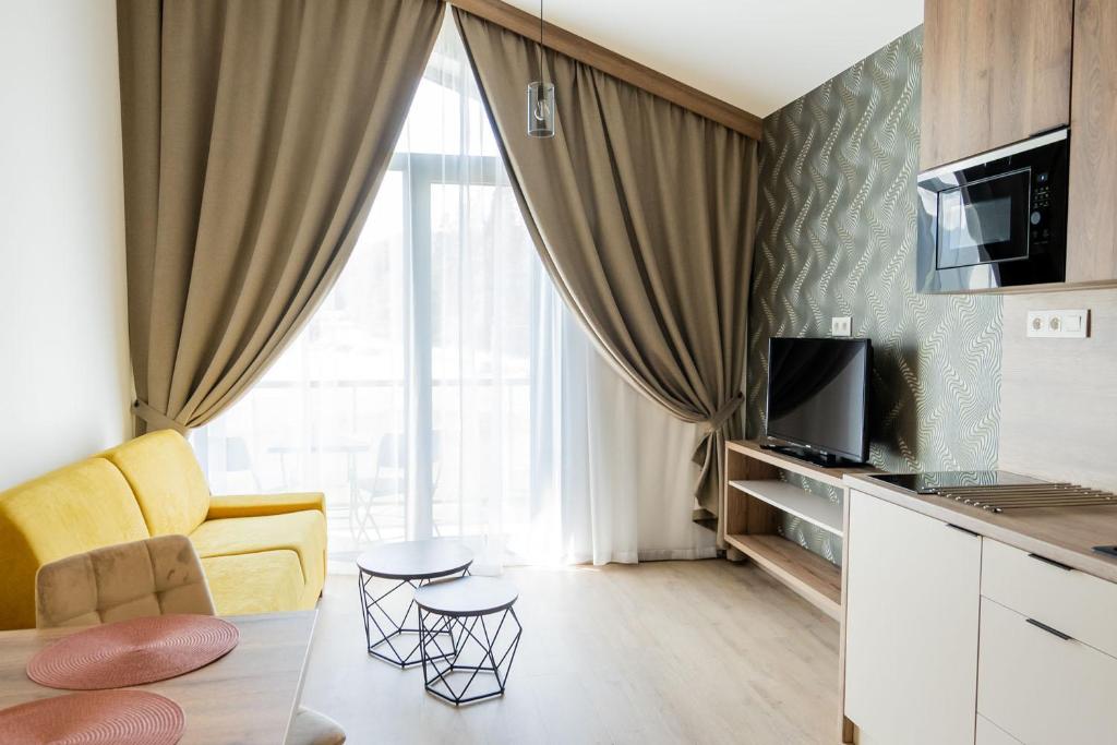 TV a/nebo společenská místnost v ubytování Apartmány Hájenka Oravice