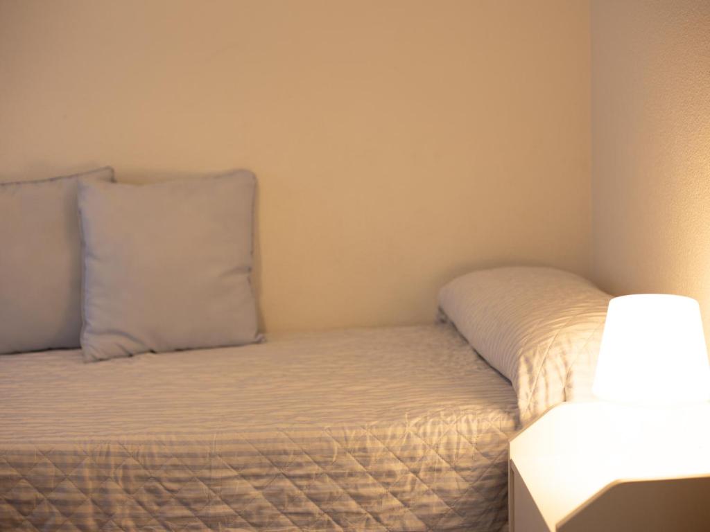 A bed or beds in a room at Alojamiento Turistico Zamora 58