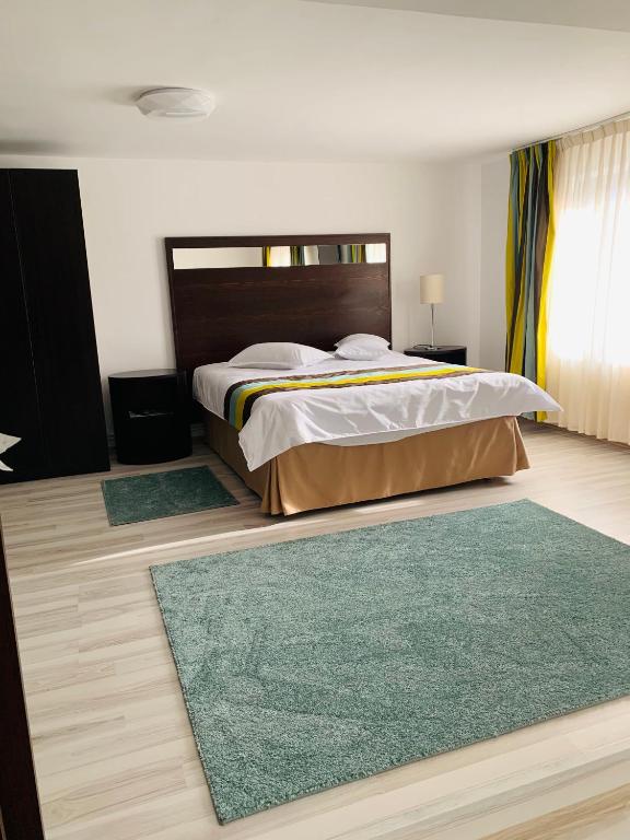 Postel nebo postele na pokoji v ubytování Casa Lazar