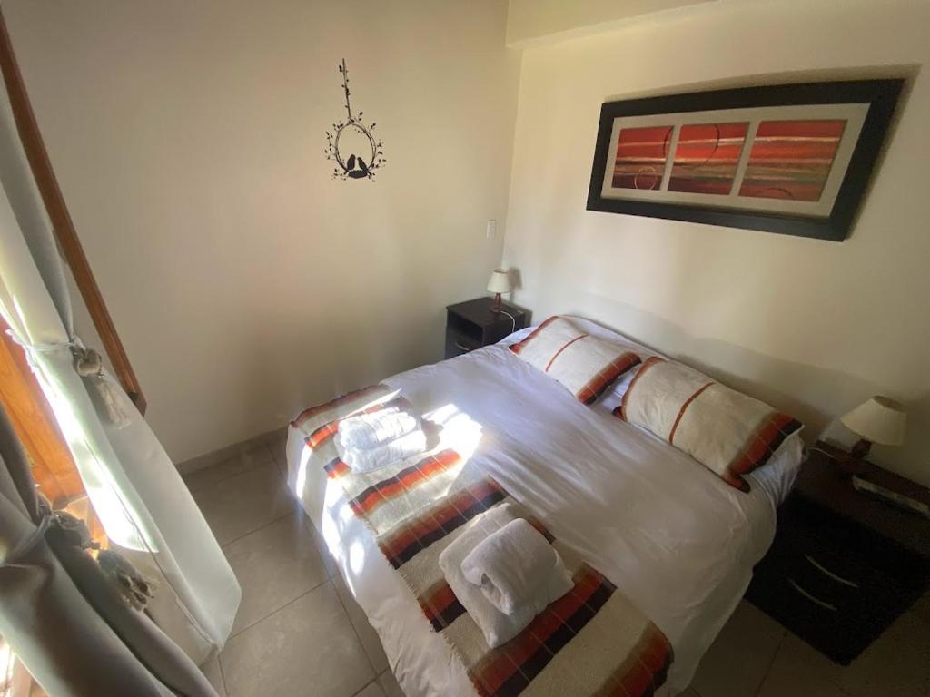 Postel nebo postele na pokoji v ubytování Chacras de Coria Apart
