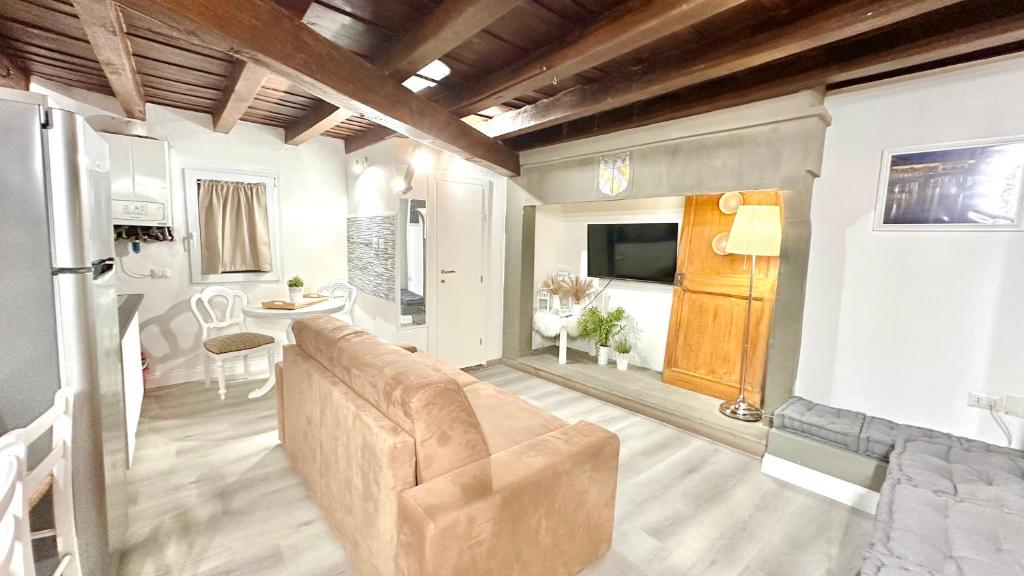 a living room with a couch and a table at Porta Rossa - Boutique Home in Florence in Florence