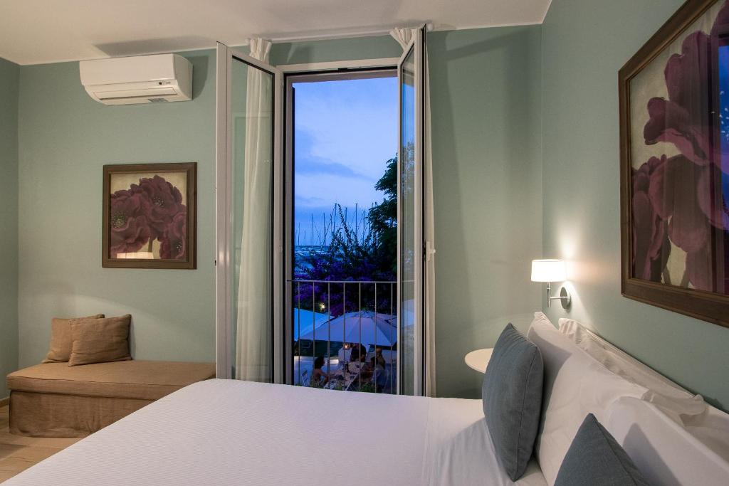 Postel nebo postele na pokoji v ubytování Blu Hotel