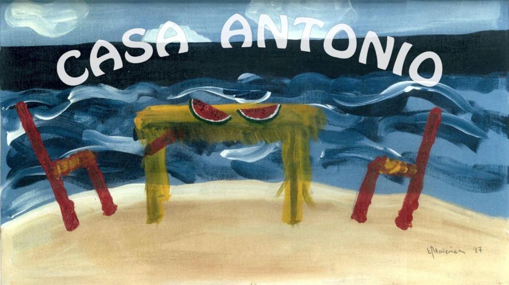 una pintura de una mesa con sandías. en Casa Antonio - apartamento Orion en Playa de San Juan