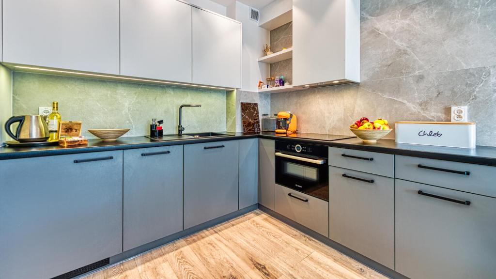 Kuchnia lub aneks kuchenny w obiekcie Rezydencja Niechorze 328 - 5D Apartamenty