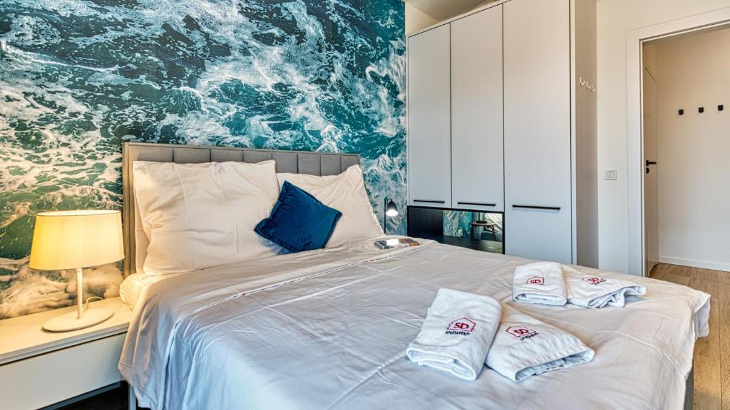 Łóżko lub łóżka w pokoju w obiekcie Rezydencja Niechorze 328 - 5D Apartamenty