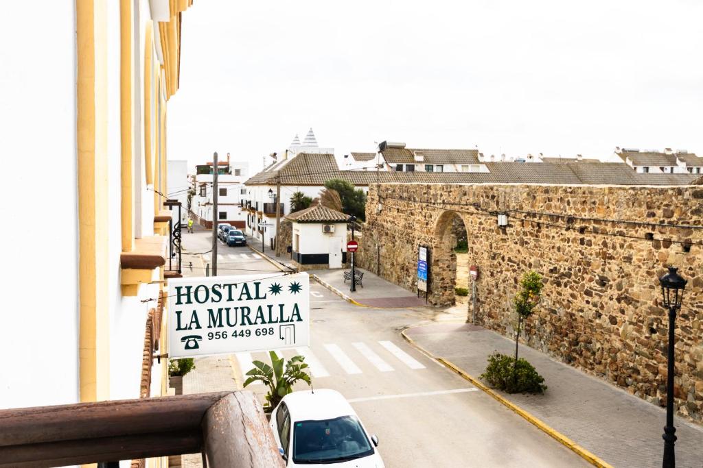 a view of a street from a balcony of a building at Hostal La Muralla in Zahara de los Atunes