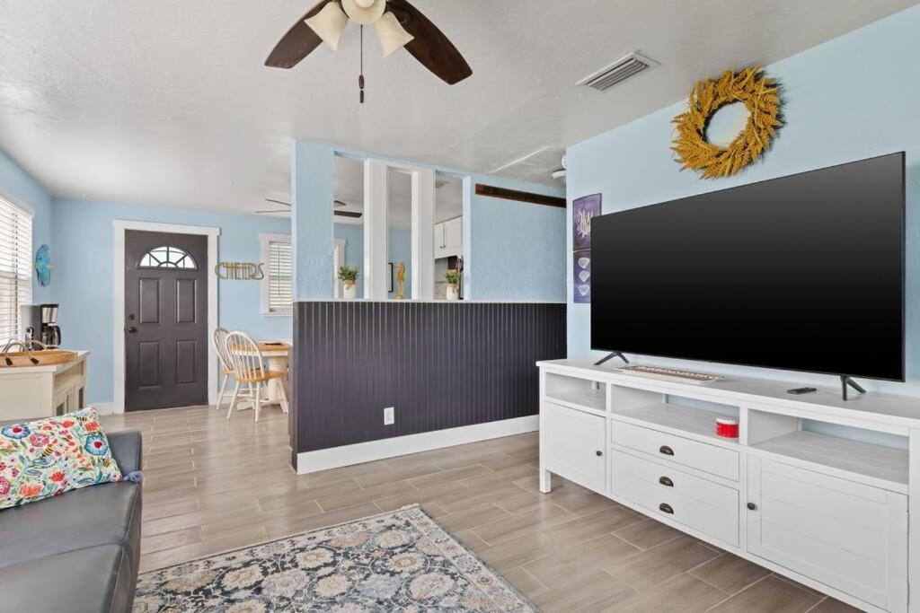 a living room with a large flat screen tv at Downtown Punta Gorda 3 bd Bungalow in Punta Gorda