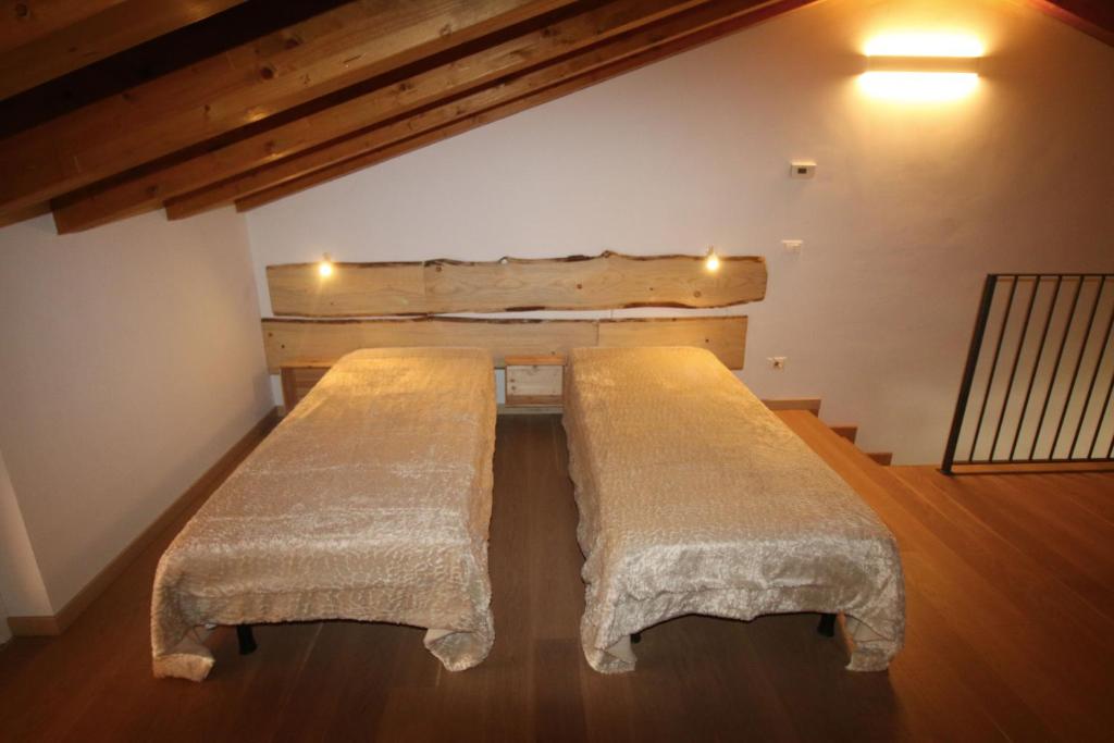 Postel nebo postele na pokoji v ubytování Vigne di Scanzo