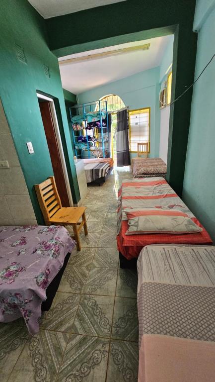 Postel nebo postele na pokoji v ubytování Hotel Los Chow Chow