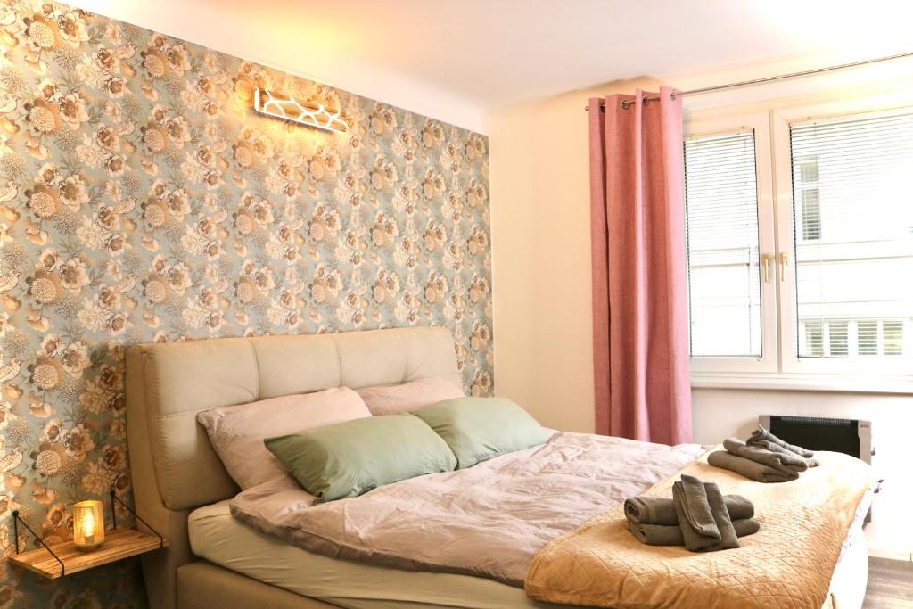 Postel nebo postele na pokoji v ubytování Philux City Apartment
