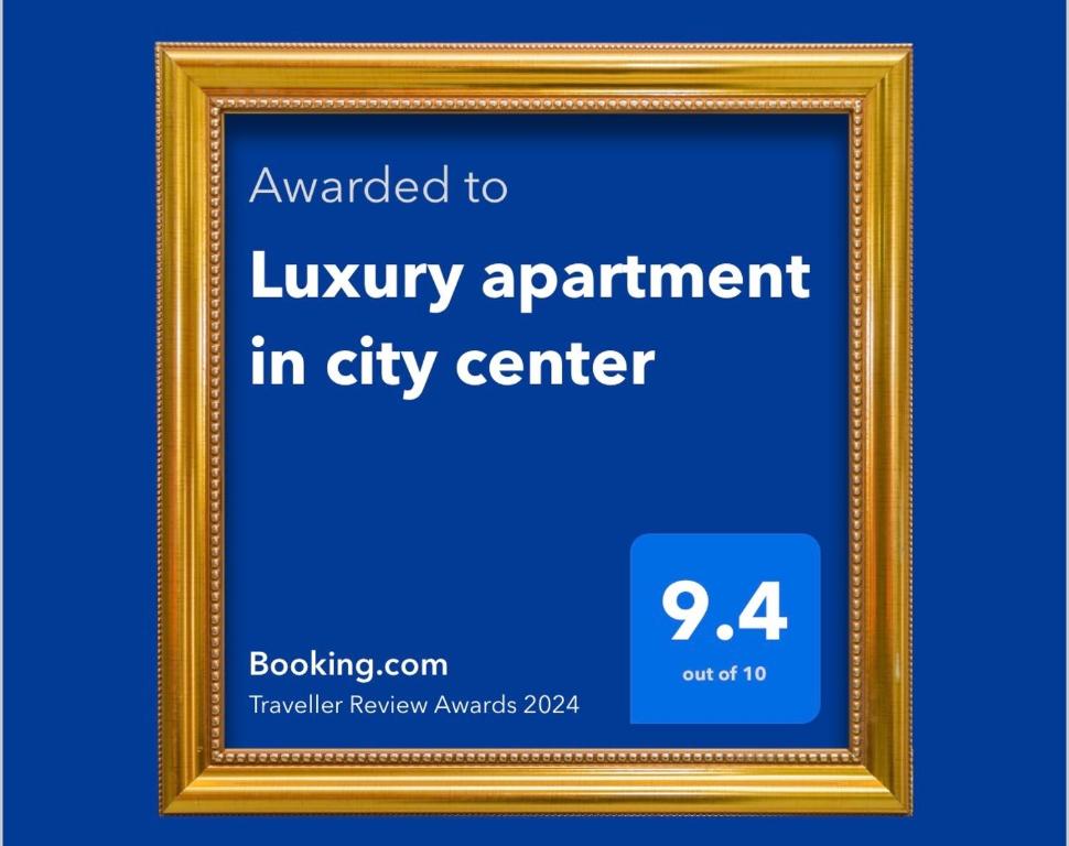 un marco de imagen con el texto otorgado al apartamento de lujo en el centro de la ciudad en Luxury apartment in city center en Spišská Nová Ves