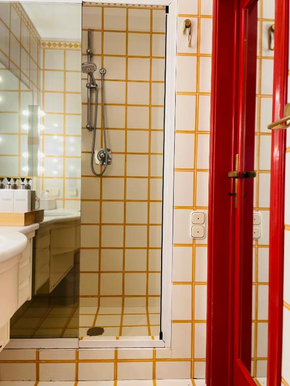 a bathroom with a shower and a sink at Lake Front View on Viale GENO in Como