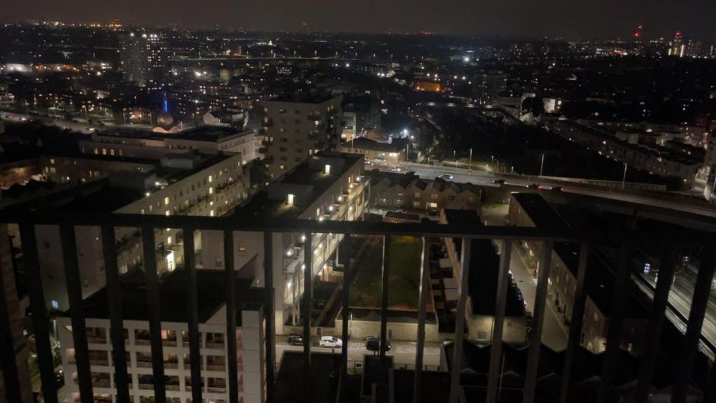 a view of a city at night at New Luxury 2 Bedroom apartment with a beautiful London City view in Barking