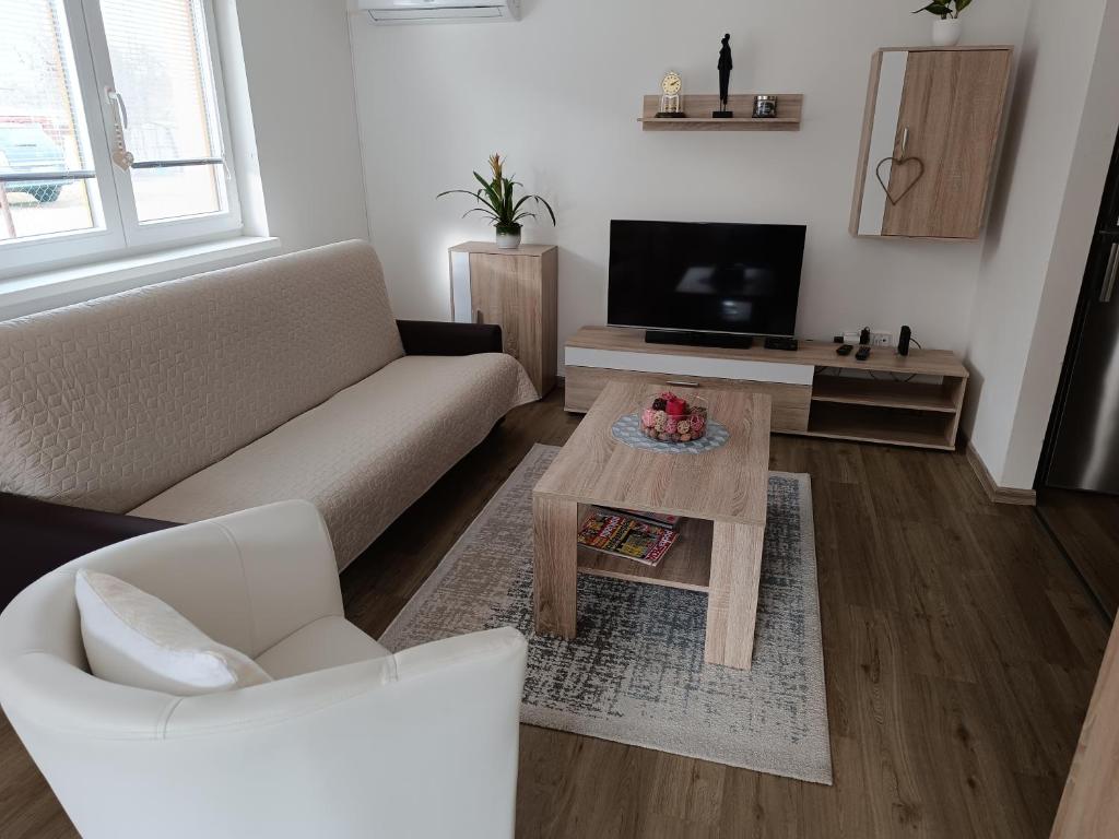 a living room with a couch and a coffee table at Apartmány Svítkov 79 in Pardubice