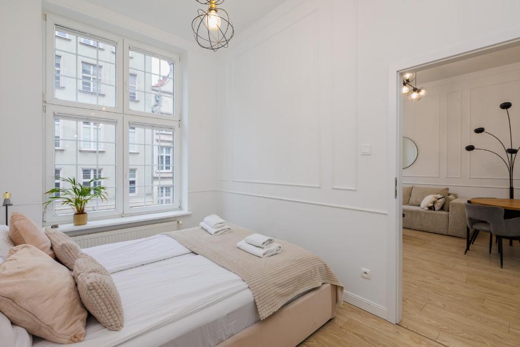 Posteľ alebo postele v izbe v ubytovaní Gdansk Apartments