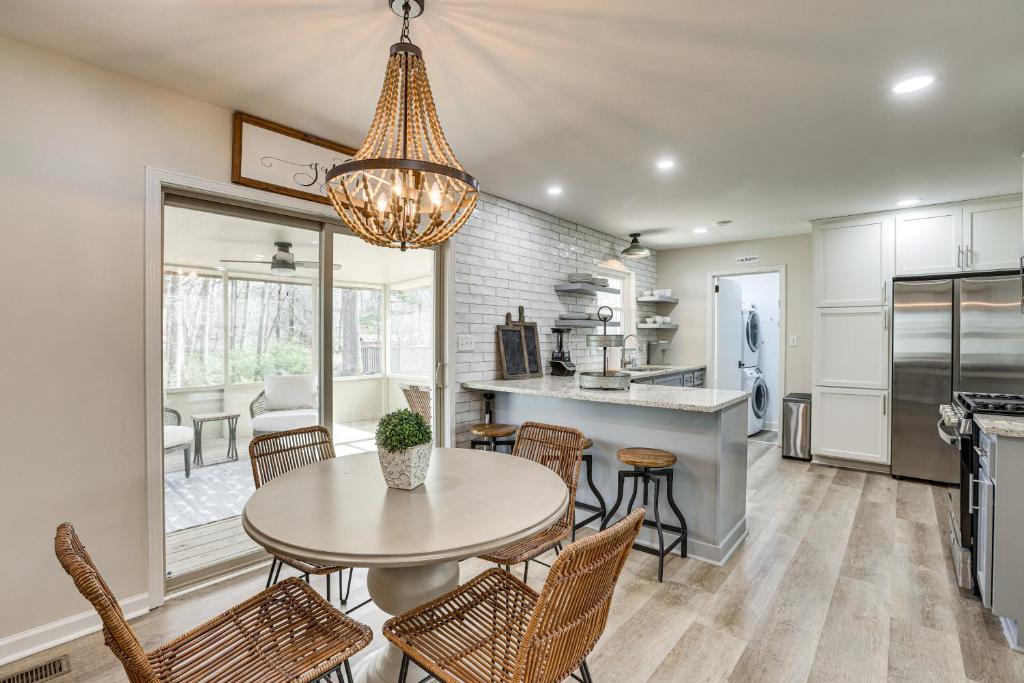a kitchen and dining room with a table and chairs at Pet-Friendly Fultondale Home about 9 Mi to Birmingham! in Fultondale