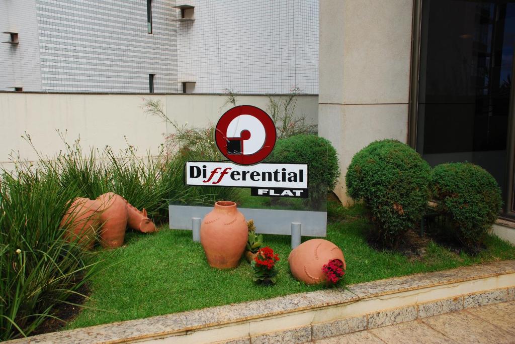 a display of a differential tax sign in front of a building at Differential Flat in Belo Horizonte