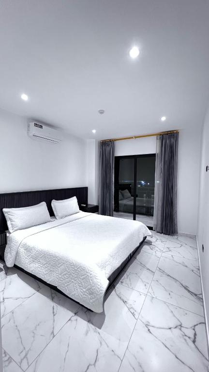 Postel nebo postele na pokoji v ubytování Manta Surf Hotel