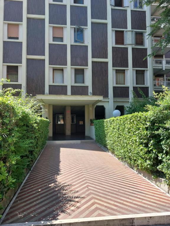 a building with a walkway in front of it at #Punto FM 2# in Marghera