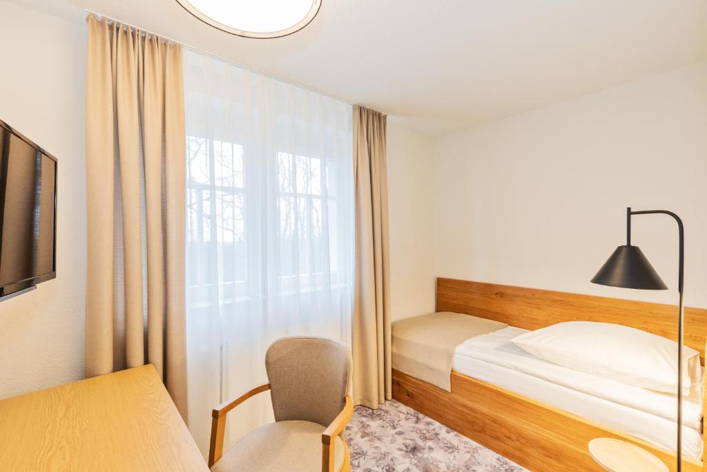 Postel nebo postele na pokoji v ubytování Hotel Zum Pfeiffer