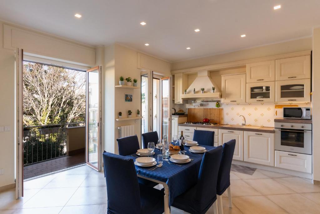 a dining room with a table and chairs and a kitchen at L'Arancio house- Perfect for families and groups in Sorrento
