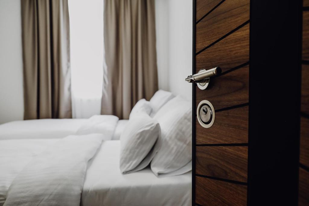 Postel nebo postele na pokoji v ubytování S Apart Rooms