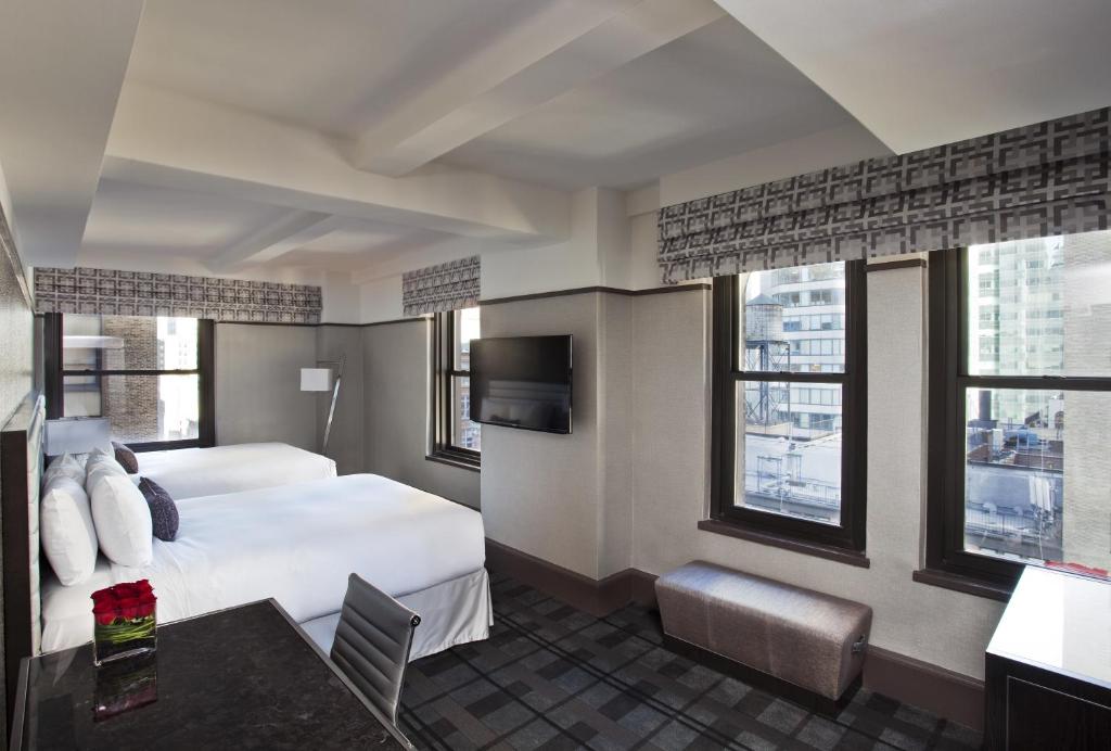 Ein Bett oder Betten in einem Zimmer der Unterkunft Park Central