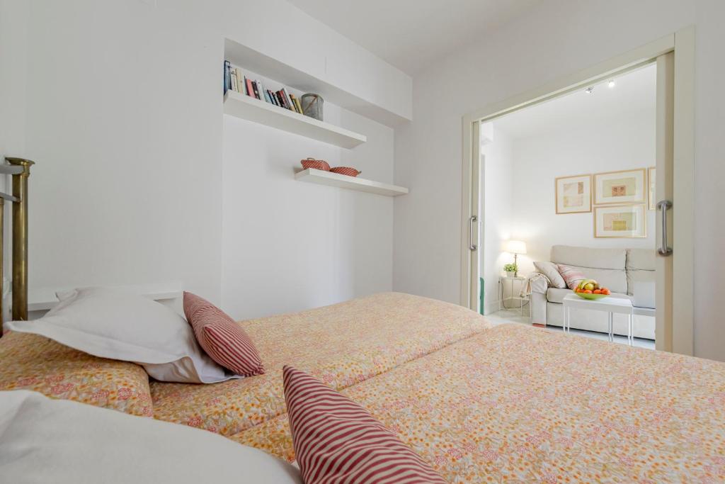 Postel nebo postele na pokoji v ubytování Sevilla Home Center