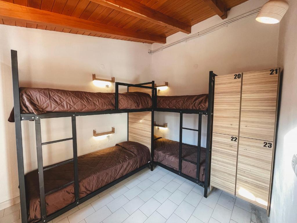 Postel nebo postele na pokoji v ubytování Hostel Falucho