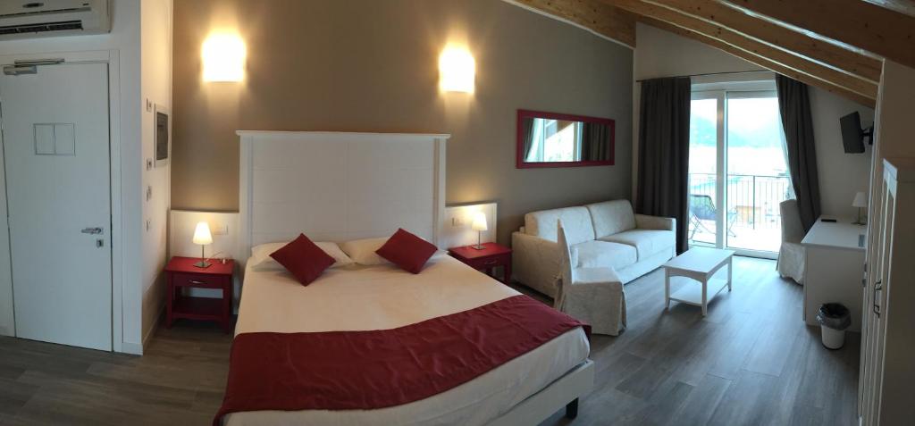 Postel nebo postele na pokoji v ubytování Hotel Resort Le Vele
