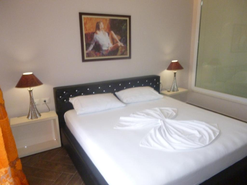 Postel nebo postele na pokoji v ubytování Villamaria Hotel