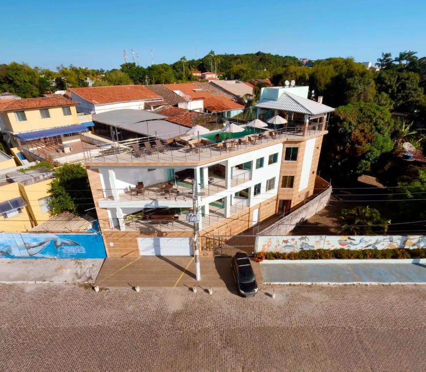 an aerial view of a house with a swimming pool at Triplex Curumim - Zohra in Itaparica