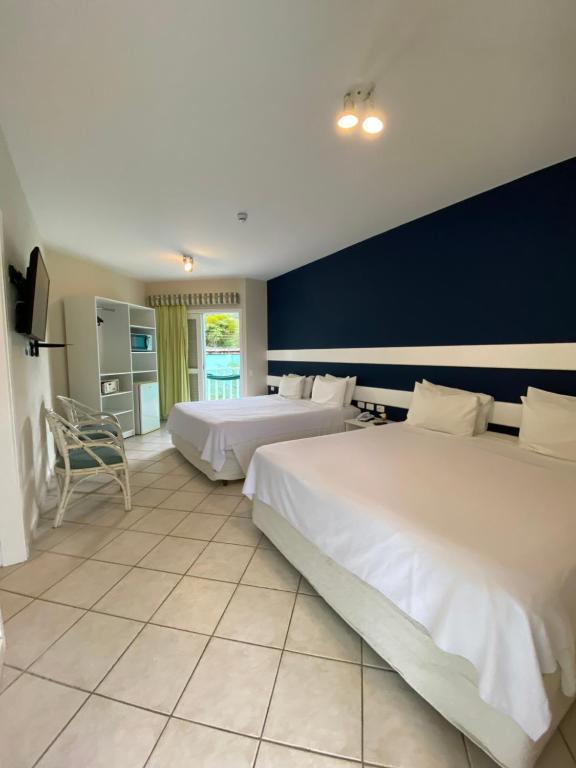 Postel nebo postele na pokoji v ubytování Hotel Port Louis