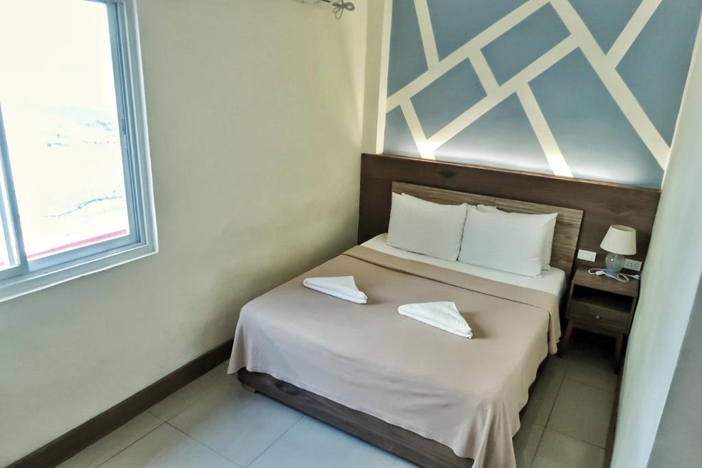 Postel nebo postele na pokoji v ubytování LEUX Hotel Alona Panglao