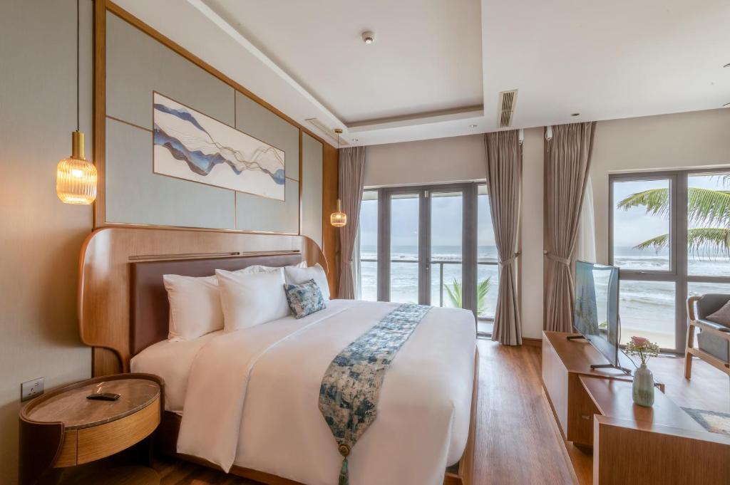 Postel nebo postele na pokoji v ubytování KOI Resort & Residence Da Nang