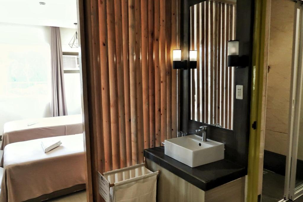 Postel nebo postele na pokoji v ubytování LEUX Hotel Alona Panglao